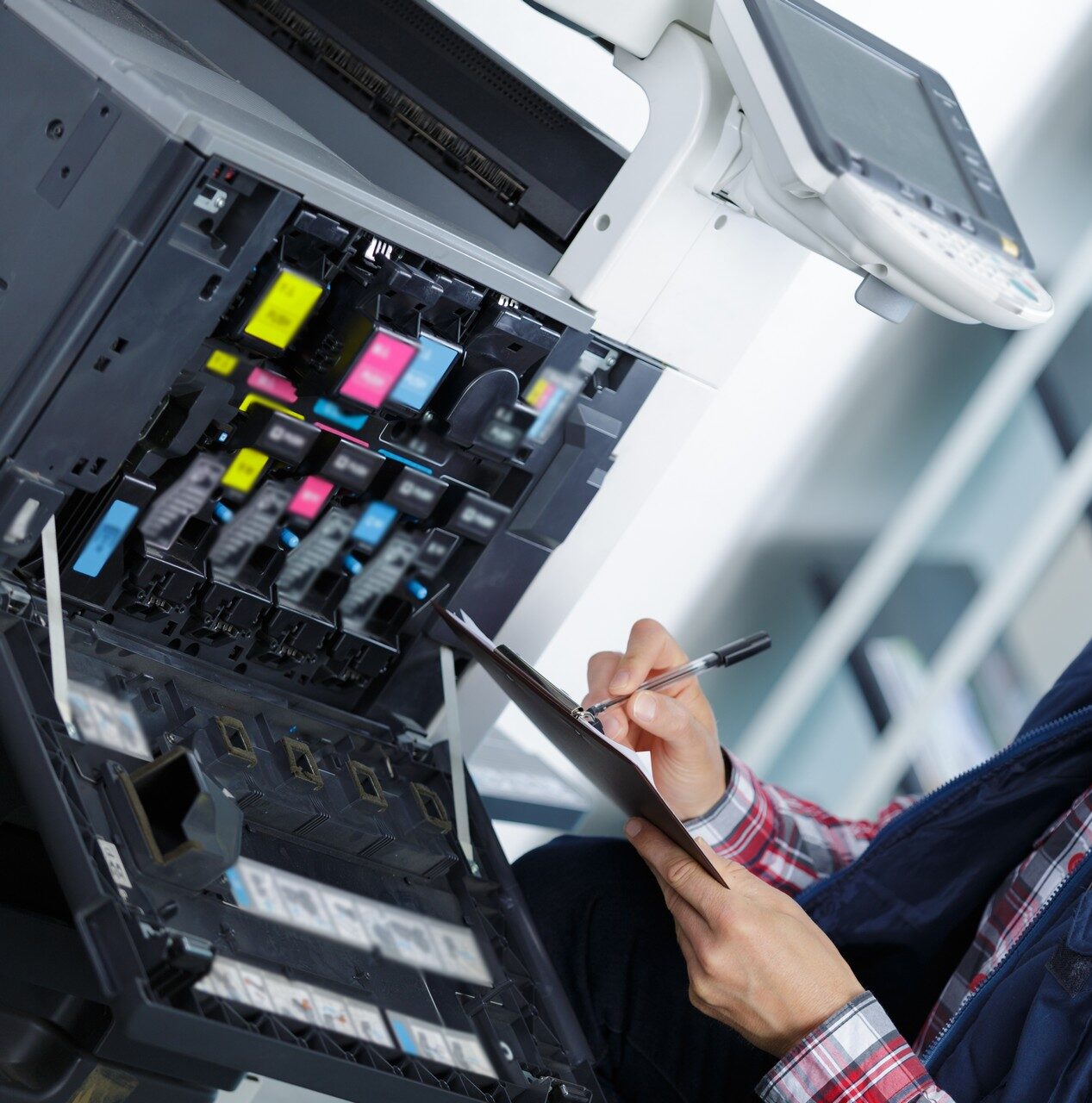 handyman fixing the office printer